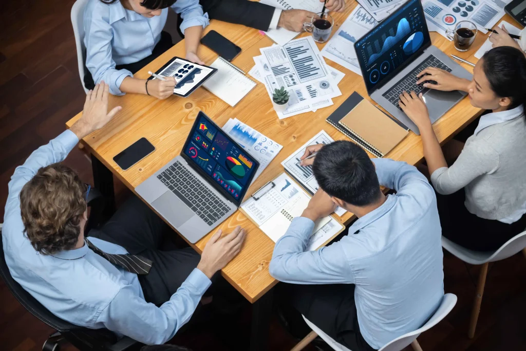 Business team using custom enterprise software to replace multiple disconnected tools, streamline workflows, automate processes, and improve operational efficiency across departments.
