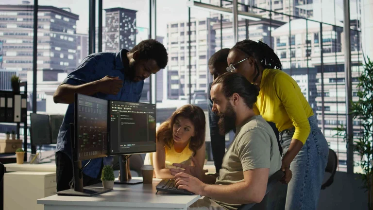 Austin software development company team reviewing custom application project scope, coding workflow, technical architecture, deadlines, client collaboration, and project planning.
