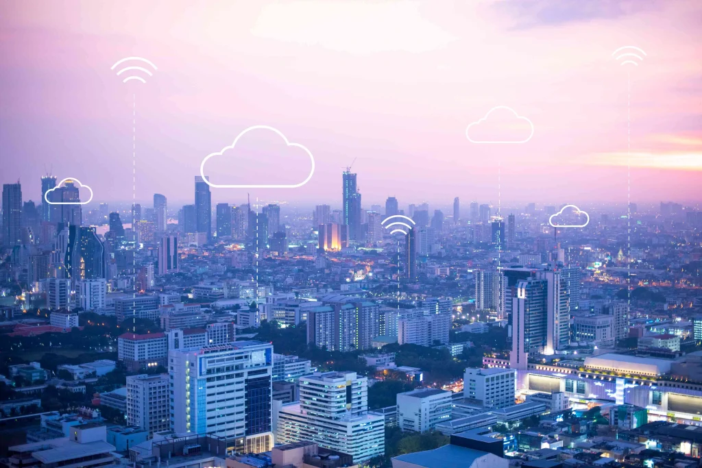 IoT implementation cost illustration showing connected industrial sensors, smart factory equipment, cloud dashboards, predictive maintenance, real-time monitoring, data analytics, IoT networks, and enterprise automation helping US businesses reduce downtime and improve operational efficiency in 2026.